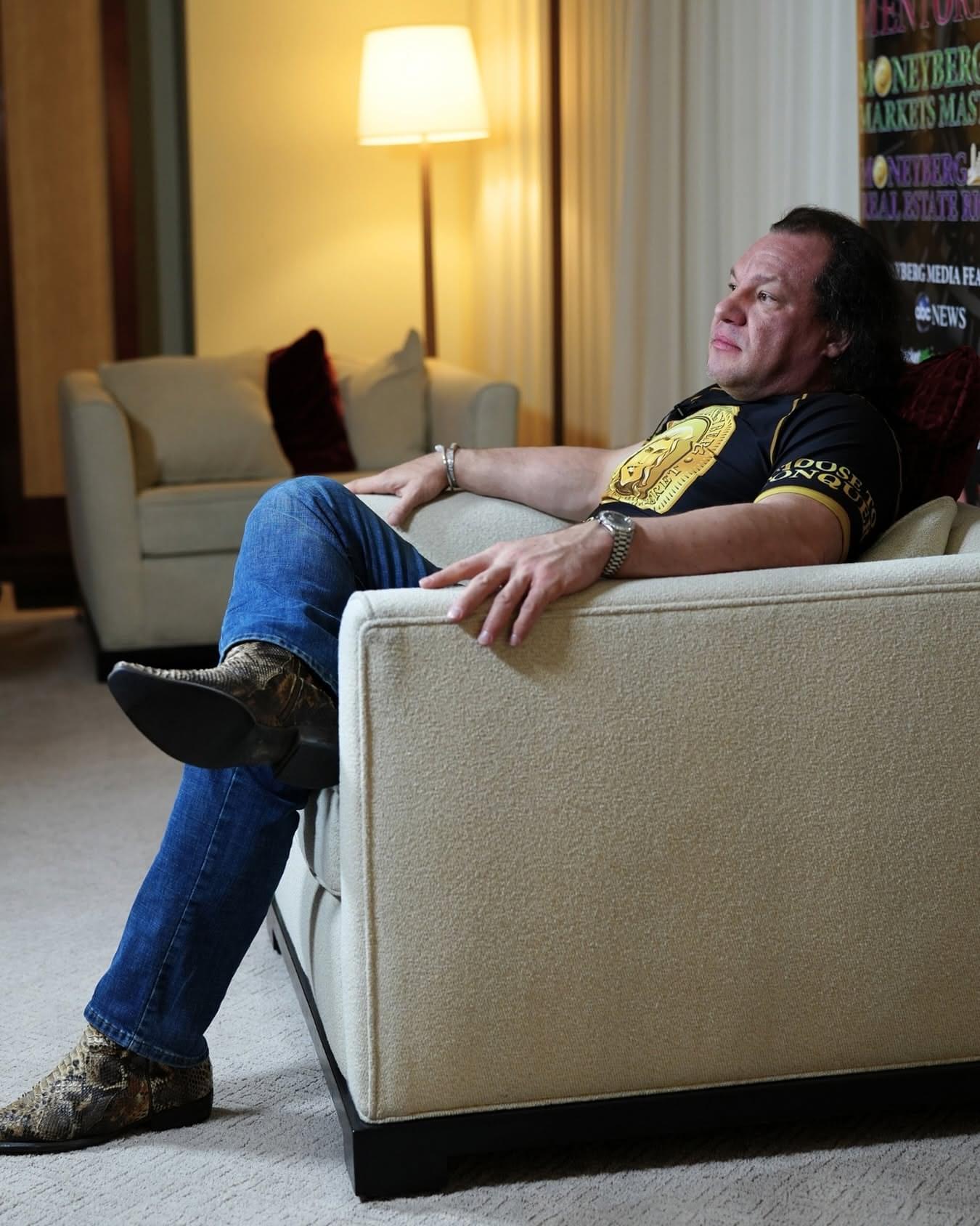 Derek Moneyberg seated in an armchair